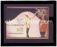 2y1714 GILDED LILY glass slide 1921 cool art of pretty Mae Murray looking at flowers in giant vase!