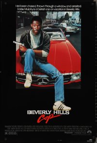 3b1669 BEVERLY HILLS COP 1sh 1984 great image of detective Eddie Murphy sitting on red Mercedes!