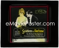 3t1293 SOLDIERS OF FORTUNE glass slide 1919 Pauline Starke can't look Norman Kerry in the eyes!