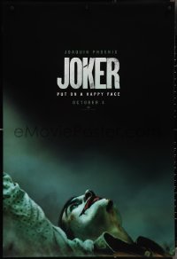 3w0827 JOKER teaser DS 1sh 2019 close-up image of clown Joaquin Phoenix, put on a happy face!