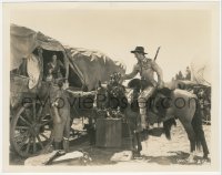 4t1437 BIG TRAIL 8x10.25 still 1930 young John Wayne on horseback giving turkey to hungry family!