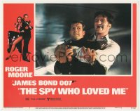 4t0766 SPY WHO LOVED ME LC #2 1977 Roger Moore as James Bond squeezed by giant Richard Kiel as Jaws!