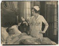 4y1242 OH DOCTOR 8x10.25 still 1925 Reginald Denny smiles as nurse Mary Astor takes his temperature!