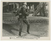 4y1253 RIO BRAVO 8x10.25 still 1959 close up of John Wayne with rifle on street, Howard Hawks!