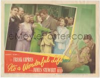 4y0209 IT'S A WONDERFUL LIFE LC #5 1946 James Stewart hugging Donna Reed at wedding, Frank Capra!