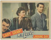 4y0569 MR. LUCKY LC 1943 Laraine Day in fur coat staring at perplexed Cary Grant, gambling classic!