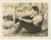 5b1851 MODERN TIMES 8x10.25 still 1936 close up of Charlie Chaplin leaning against tree tying his shoe!