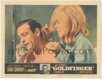 5j1411 GOLDFINGER LC #2 1964 c/u of sexy Shirley Eaton behind Sean Connery as James Bond on phone!