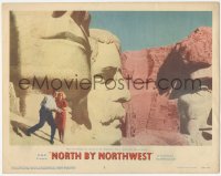 5p0203 NORTH BY NORTHWEST LC #5 1959 classic image of Cary Grant & Eva Marie Saint on Mt. Rushmore!