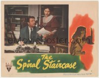 6b0551 SPIRAL STAIRCASE LC 1946 Rhonda Fleming shows paper to George Brent at desk, Robert Siodmak!