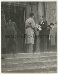 6b1250 FOREIGN CORRESPONDENT 7.75x10 still 1940 McCrea & Marshall shake hands in the rain, Hitchcock