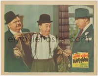 6y0715 BULLFIGHTERS LC 1945 Oliver Hardy removes Stan Laurel's coat as Ralph Sanford threatens them!