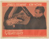 7b1051 VERTIGO LC #4 1958 Alfred Hitchcock classic, c/u of James Stewart choking brunette Kim Novak!