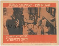 7b1052 VERTIGO LC #5 1958 Alfred Hitchcock, standing James Stewart on phone,blonde Kim Novak in bed!