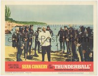 7f0610 THUNDERBALL LC #7 1965 villain Adolfo Celi surrounded by frogmen demonstrates speargun!