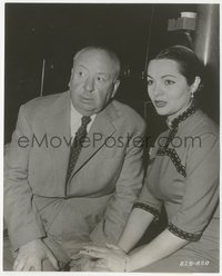 7p1474 WRONG MAN candid 7.5x9.25 still 1957 director Alfred Hitchcock visited by Sarita Montiel!